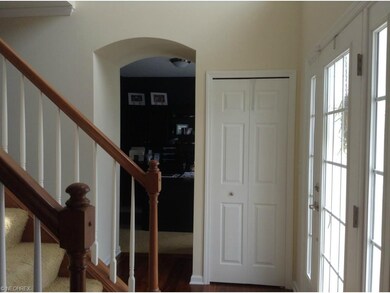 Custom archway leads to the first floor office.