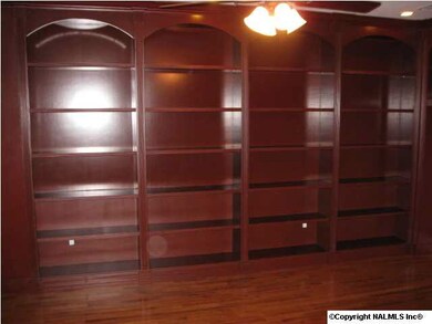 CUSTOM LIBRARY/STUDY OFF OF THE FRONT ROOM AND LEADING TO MASTER SUITE