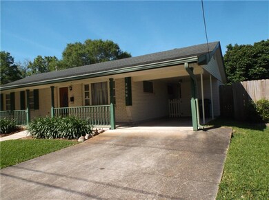 Right side view of carport and breeze way to backy