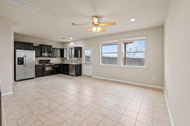 Kitchen featuring tasteful backsplash, visible ve