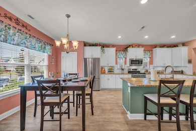 Kitchen with stainless steel appliances and features two large bars with seating.  This picture is the center island bar.  Reverse osmosis water system in the kitchen.