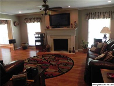 LIVING ROOM WITH HARDWOOD FLOORS AND MARBLE FIREPL