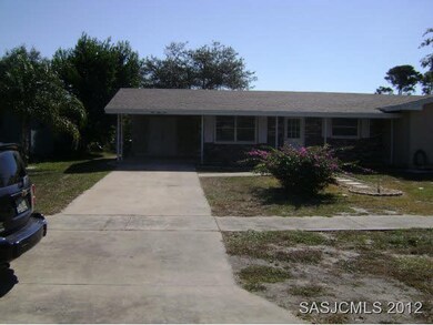 concrete driveway to carport