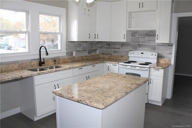 Granite tops, solid wood cabinets, showing space f