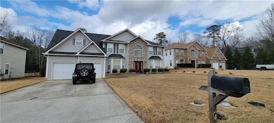 View of front of property with a garage and a fron