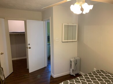 This is a clean, well-lit room with hardwood floor