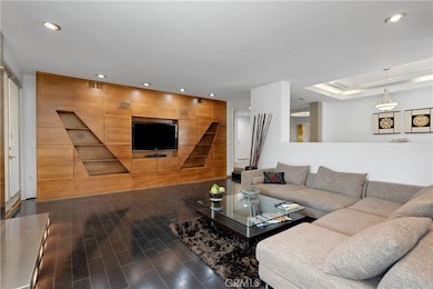 Spacious Living Room w/custom built wood cabinets & Fireplace, hardwood floors