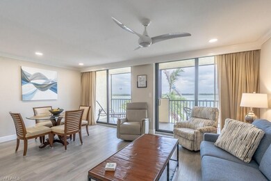 Living area with baseboards, light wood-type floor