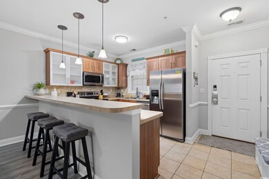 Kitchen with a breakfast bar, decorative light fix