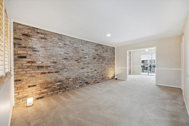 From this view you can enjoy the great flow from the large Living Rm into the Dining room which overlooks a private covered veranda and and is open to the bright Kitchen.