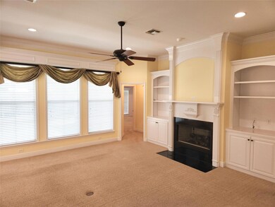 Living room with built-ins, gas fireplace and wall