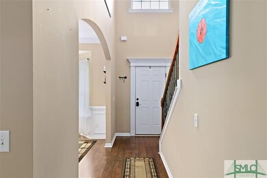 ENTER INTO THE TWO-STORY FOYER WITH WOOD FLOORING 