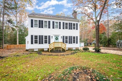 Colonial inspired home with a front lawn