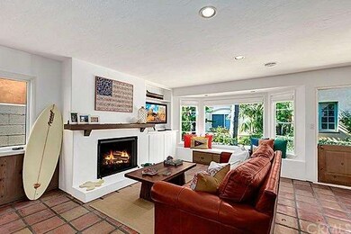 Spacious living room with cozy fireplace and bay w