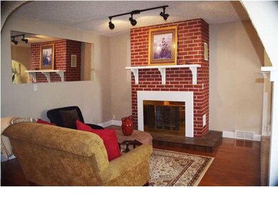 Cozy living room with fireplace, complete with blo