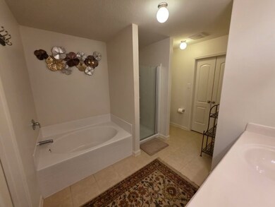 Primary Bathroom with garden tub and separate show