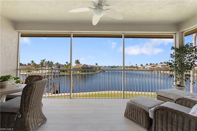 Sunroom / solarium featuring a water view and ceil