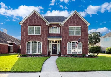 Charming brick exterior with a pristine, landscape