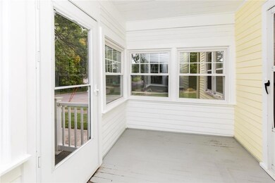 Charming enclosed porch. All windows throughout th