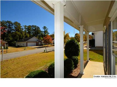 NICE COVERED PORCH TO SIT AND VISIT WITH NEIGHBORS