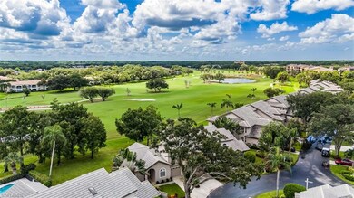 Drone / aerial view featuring a water view and golf course view