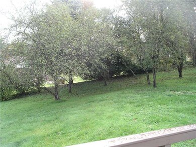 Exterior Back. Large yard with fruit trees.