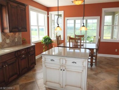 Open kitchen with dinette and access to the sun ro