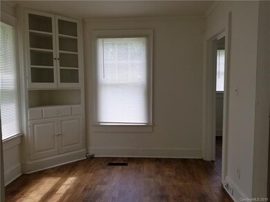 Dining room with built in corner cabinet