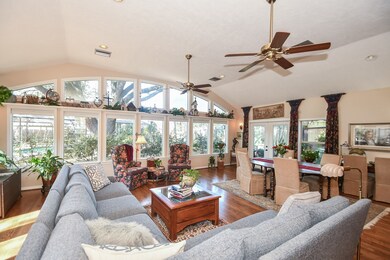 Family room overlooks landscaped yard and pool area.