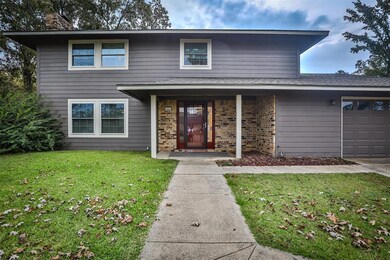 View of front of home featuring a garage and a fro