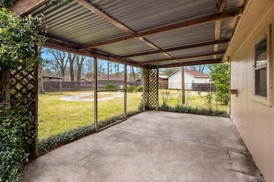Covered patio of side of the garage.