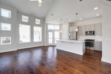 Kitchen with light countertops, stainless steel a