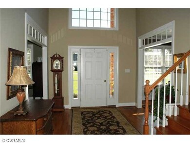 Foyer - Welcoming 2-story foyer with hardwood floo