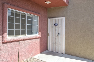 View of exterior entry featuring stucco siding