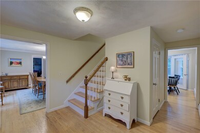 Foyer. Hardwoods. view of Dining Rm & Kitchen.
