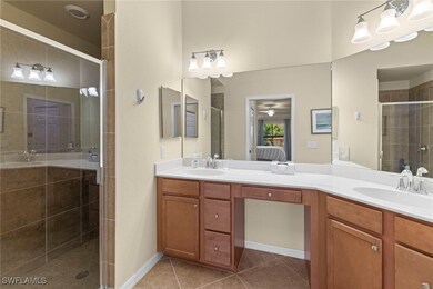 Ensuite bathroom featuring ensuite bath, a stall s