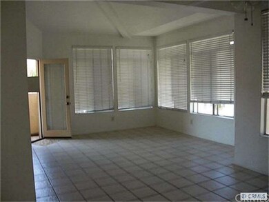 large living room with high ceilings and attached 