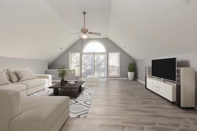 Living room with ceiling fan, wood-type flooring, 