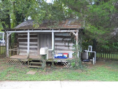 Log cabin beside pool for storage