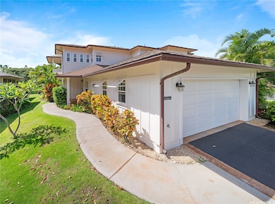 A two car garage with walk path entrance.