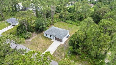 Aerial view of property and surrounding area with