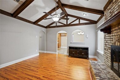 Great floors throughout the home with arched doorw