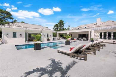 View of swimming pool with a patio, an outdoor living space, and a pool with connected hot tub