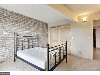 Exposed brick wall in bedroom
