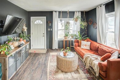 Features newer laminate flooring in the open concept living/dining room combo.