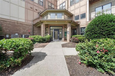 View of exterior entry featuring brick siding