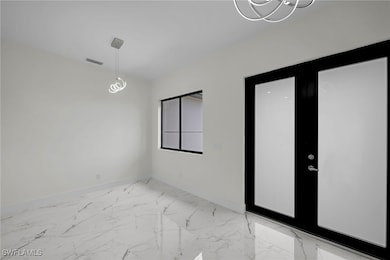 Empty room featuring tile patterned floors