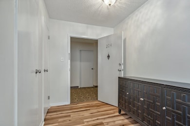 Unfurnished bedroom featuring a textured ceiling a
