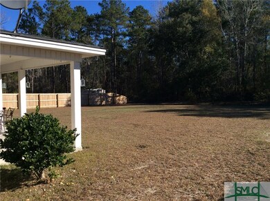Backyard.  Fully fenced.  Wood on sides and chain 