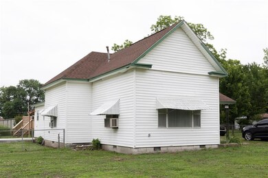 View of home's exterior with a lawn